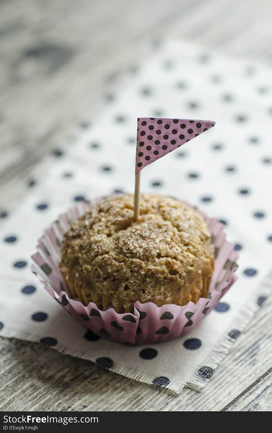 Pumpkin cupcake on old table