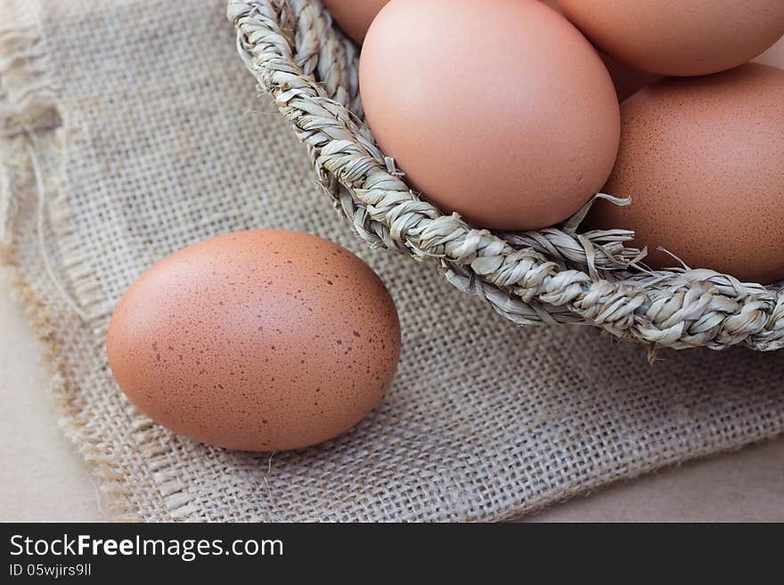 Basket with eggs on sackcloth