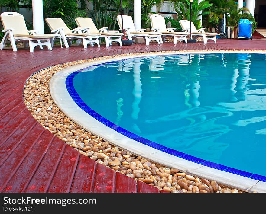 Luxury Resort Swimming Pool high angle on curved edge of a luxury resort swimming pool. Luxury Resort Swimming Pool high angle on curved edge of a luxury resort swimming pool