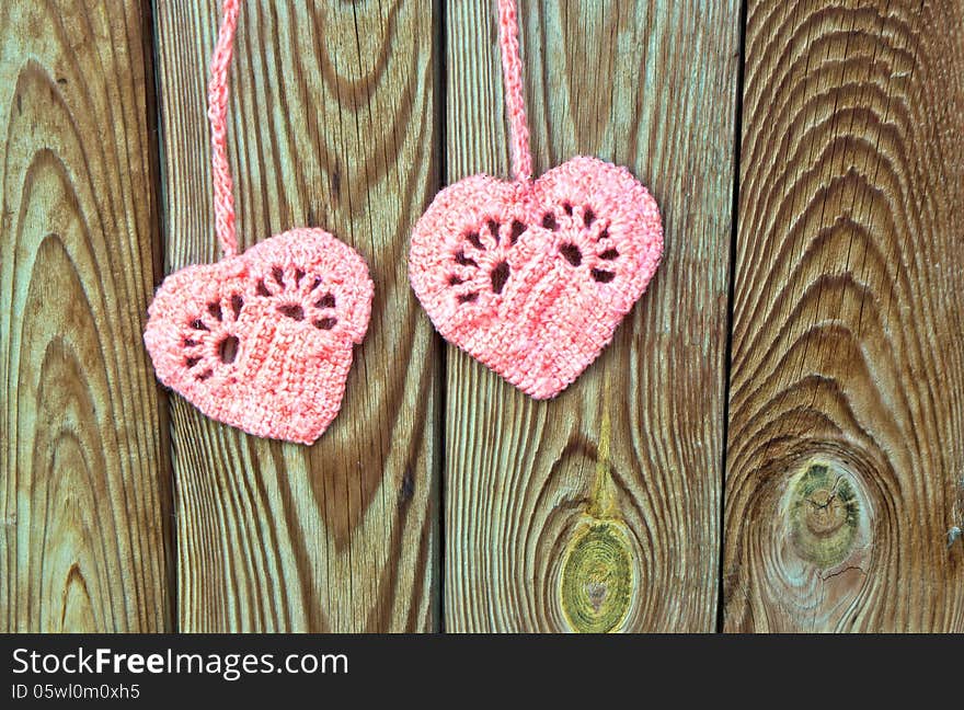 Two crocheted hearts as a symbol of love. Two crocheted hearts as a symbol of love