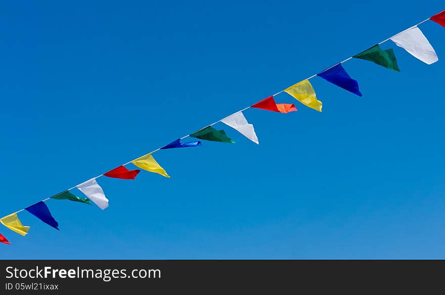 Colored Flags In The Blue Sky