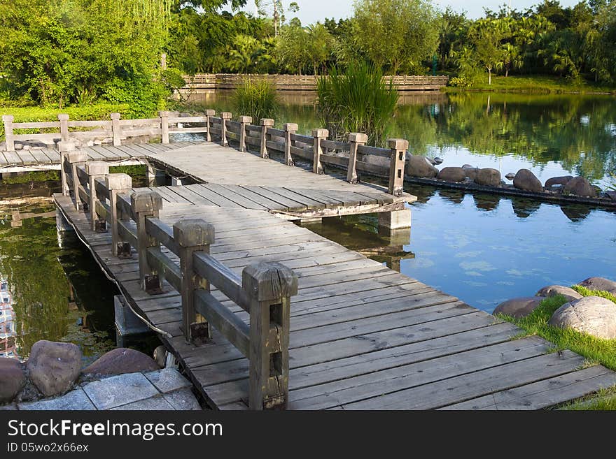 Wooden footbridge by the lake