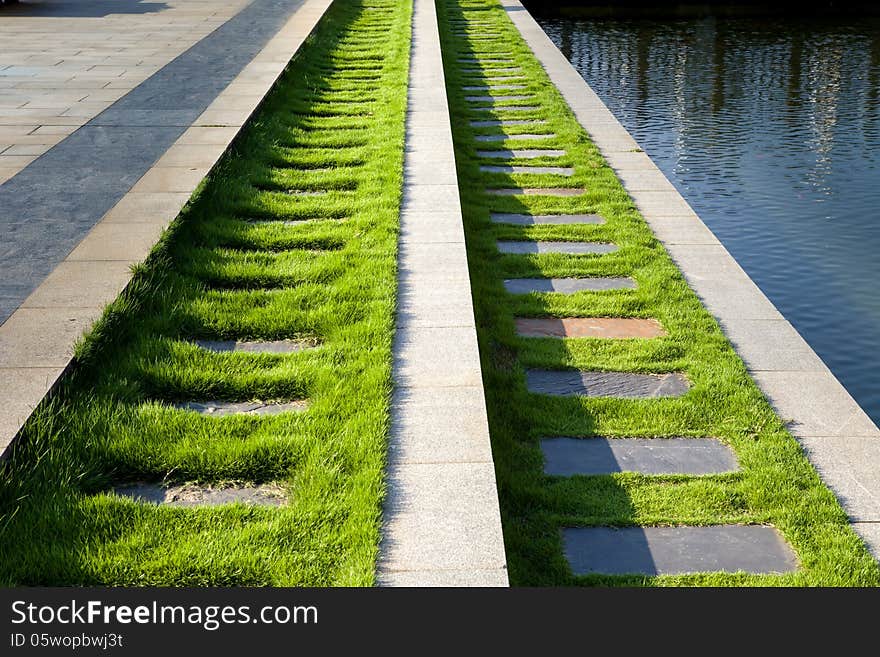 Flagstone path by lake