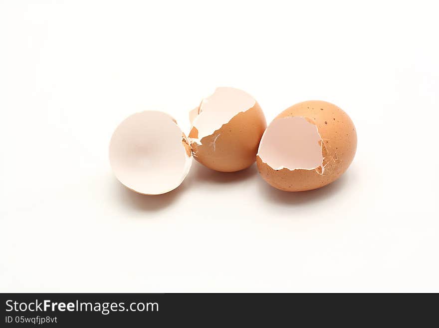 Pile of broken eggshell on white background