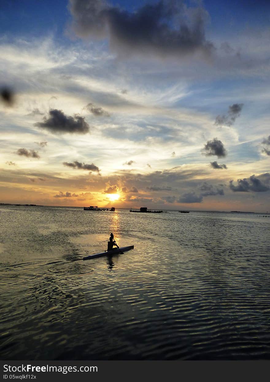 Beautiful sunset at beach located on the Promontory of the island of Java Karimun