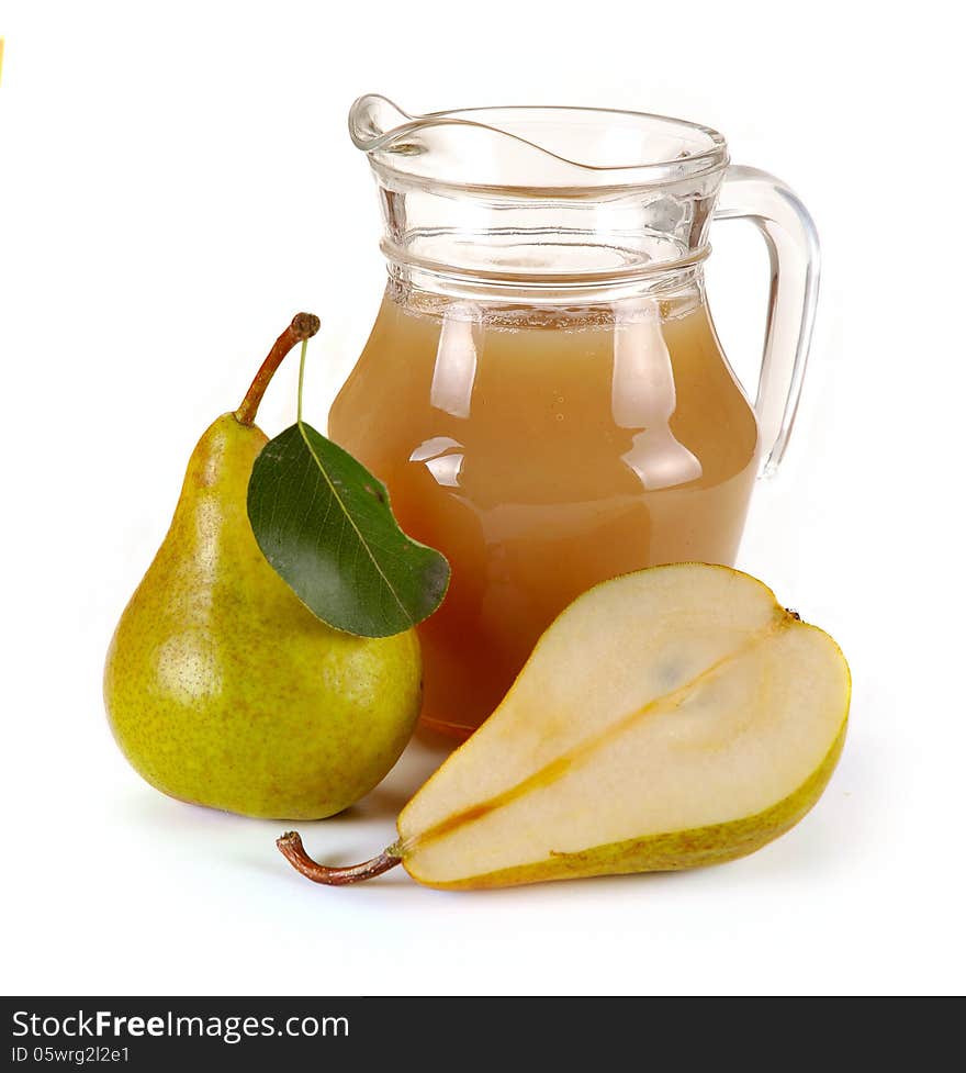 Pear juice in a jug and a glass of fruit. Pear juice in a jug and a glass of fruit