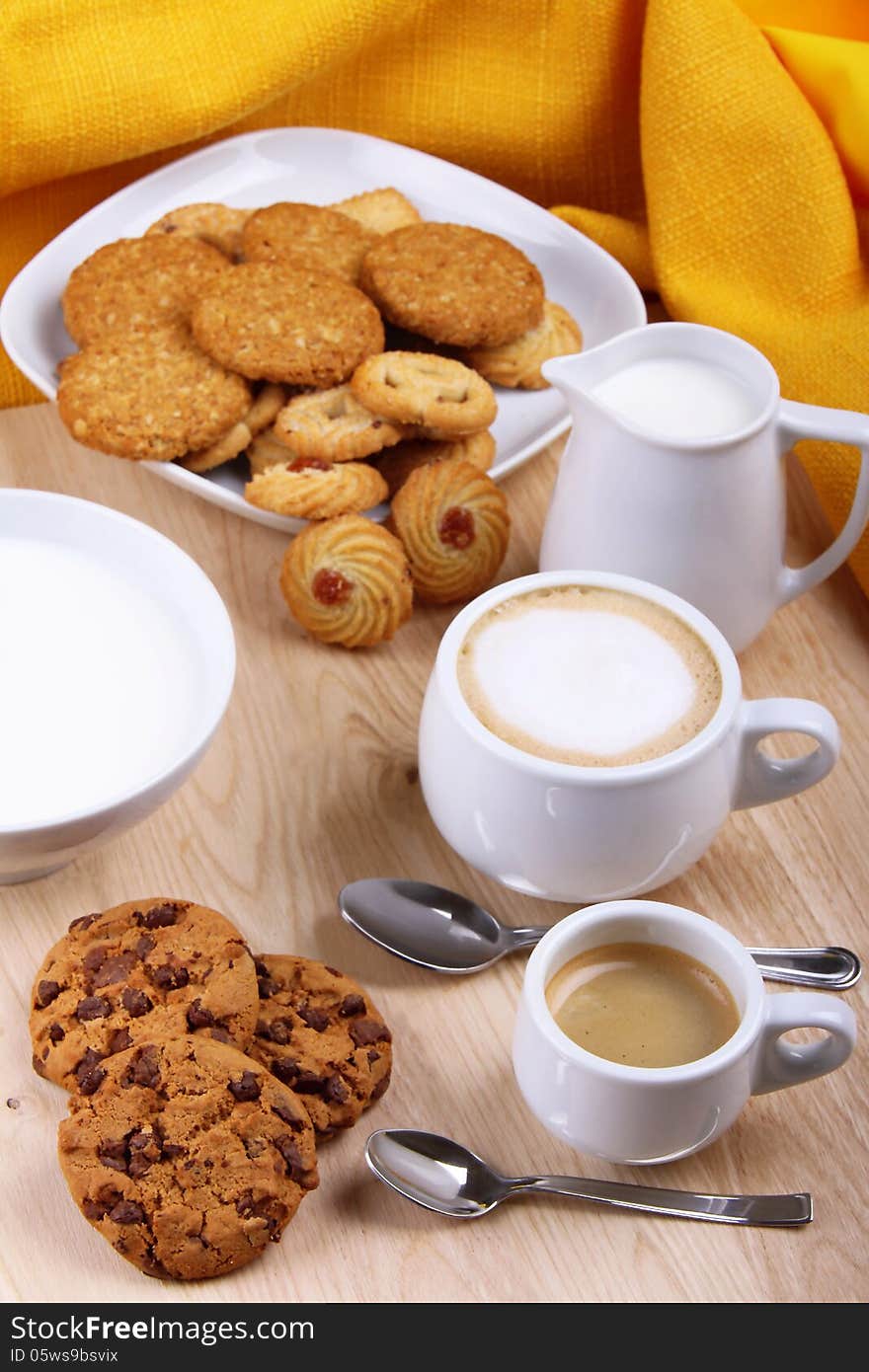 Up of chestnut with coffee, milk and coffee and pastries and chocolate chip cookies. Up of chestnut with coffee, milk and coffee and pastries and chocolate chip cookies