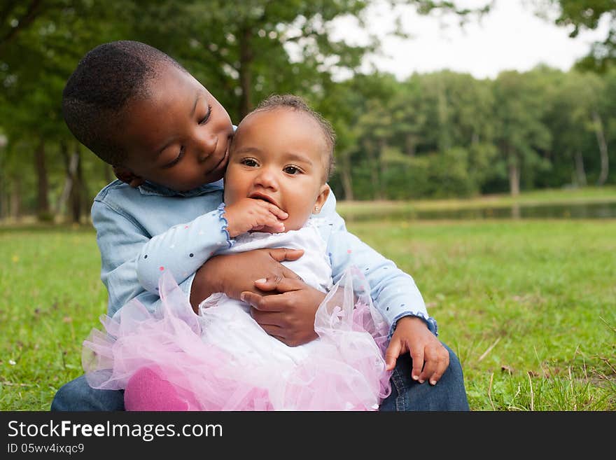 Happy little children are having a nice day in the park. Happy little children are having a nice day in the park