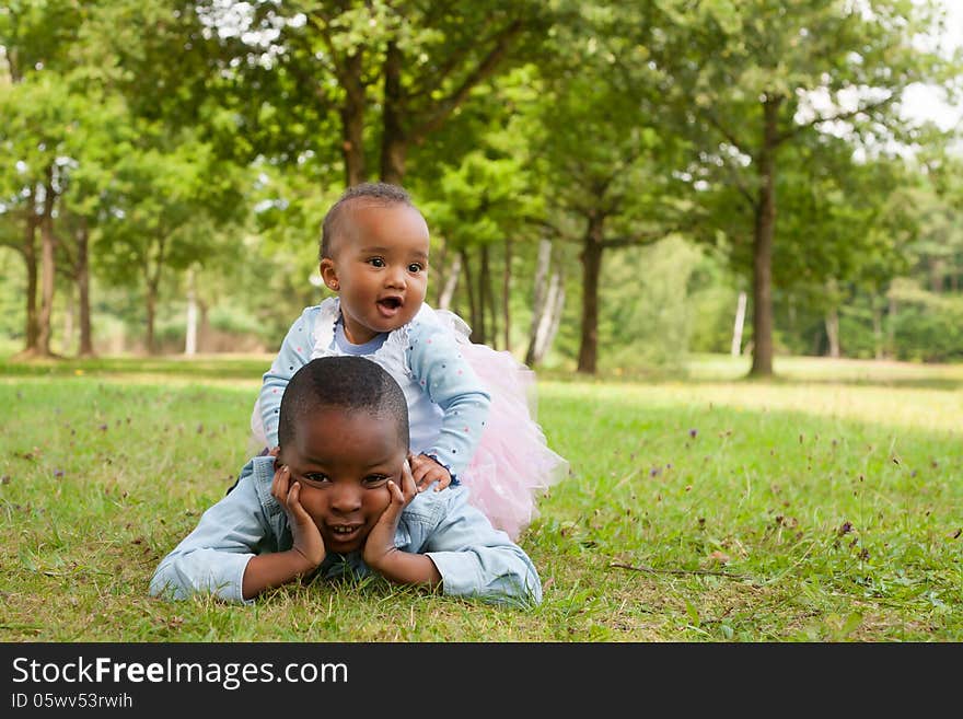 Happy little children are having a nice day in the park. Happy little children are having a nice day in the park