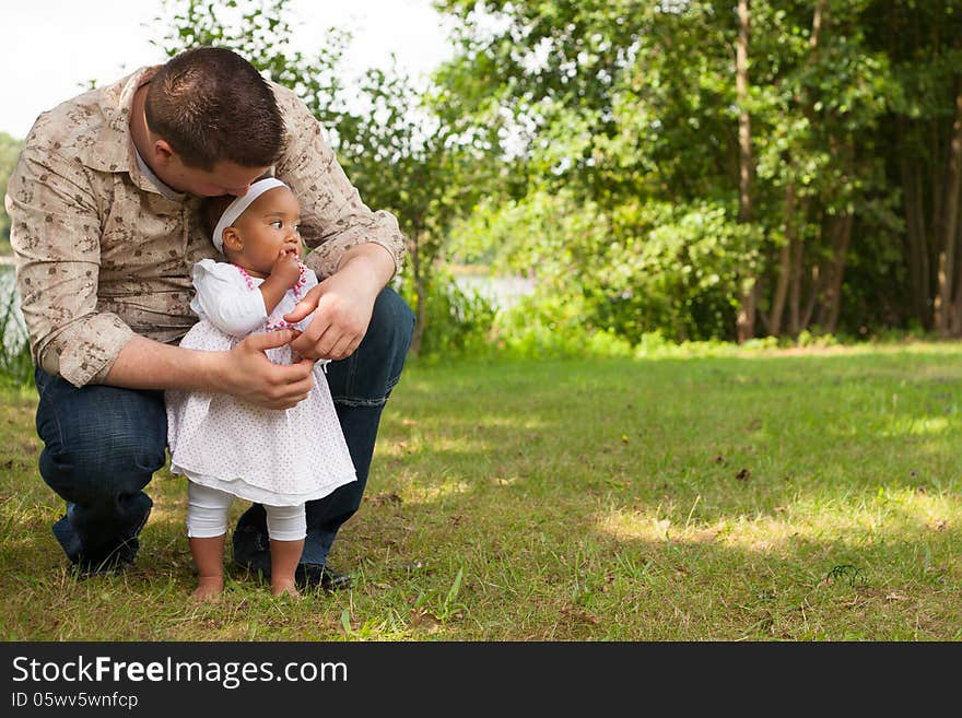 Happy mixed family is having a nice day in the park. Happy mixed family is having a nice day in the park