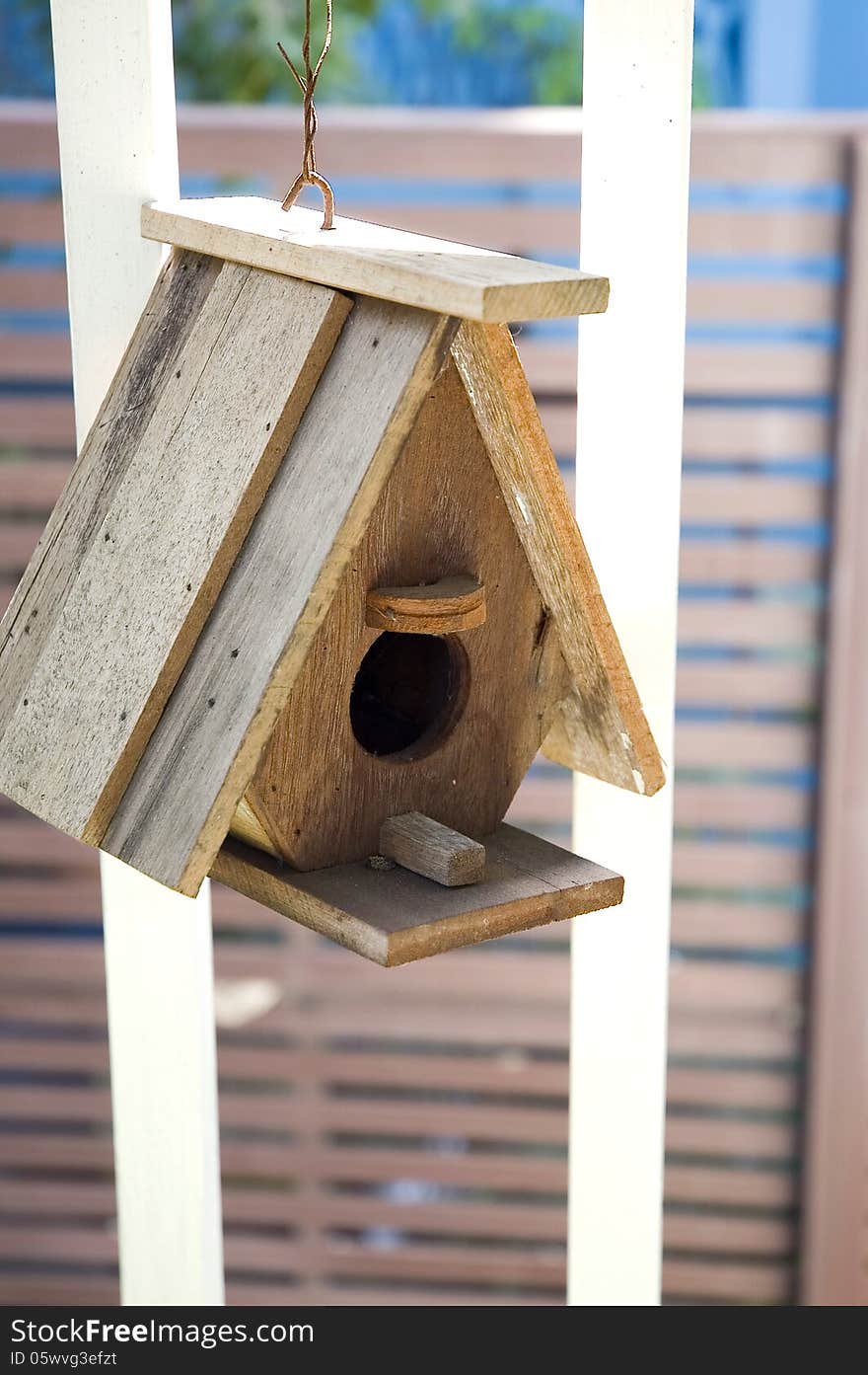 Wooden bird's house hanging outside. Wooden bird's house hanging outside