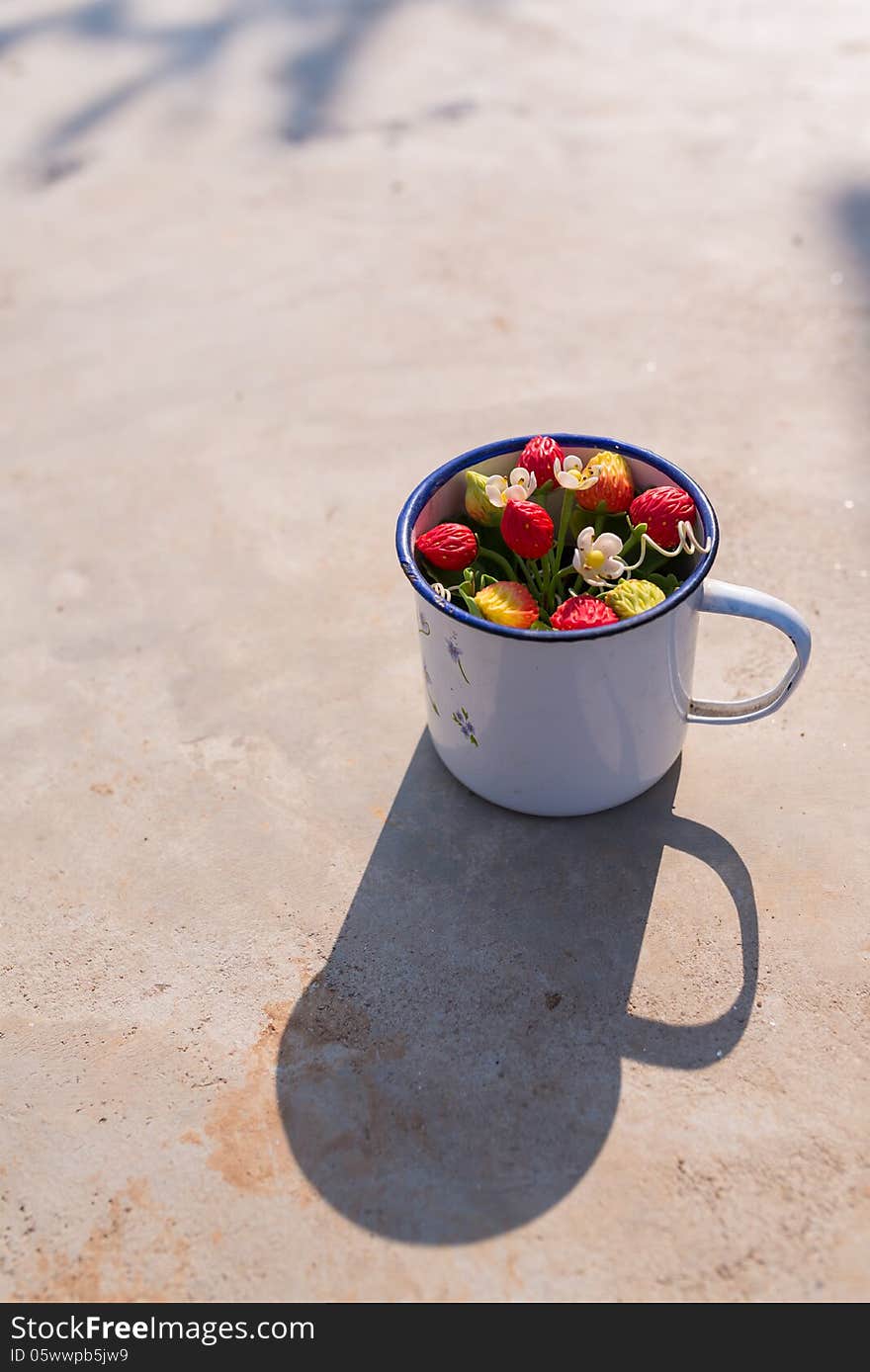 Flowers in iron water cup