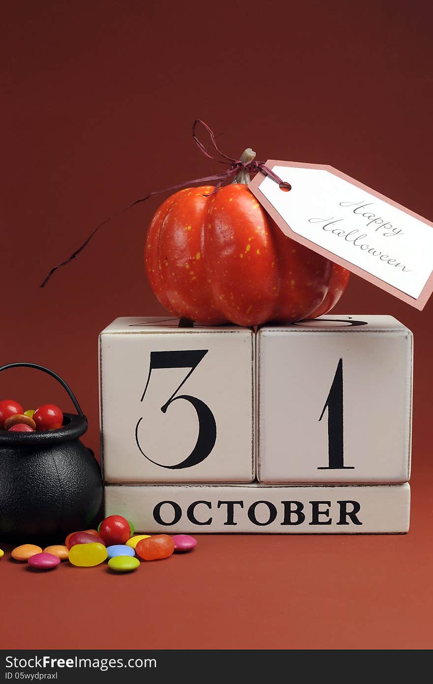 Happy Halloween save the date calendar for October 31 with pumpkin and cauldron candy. Vertical. Happy Halloween save the date calendar for October 31 with pumpkin and cauldron candy. Vertical