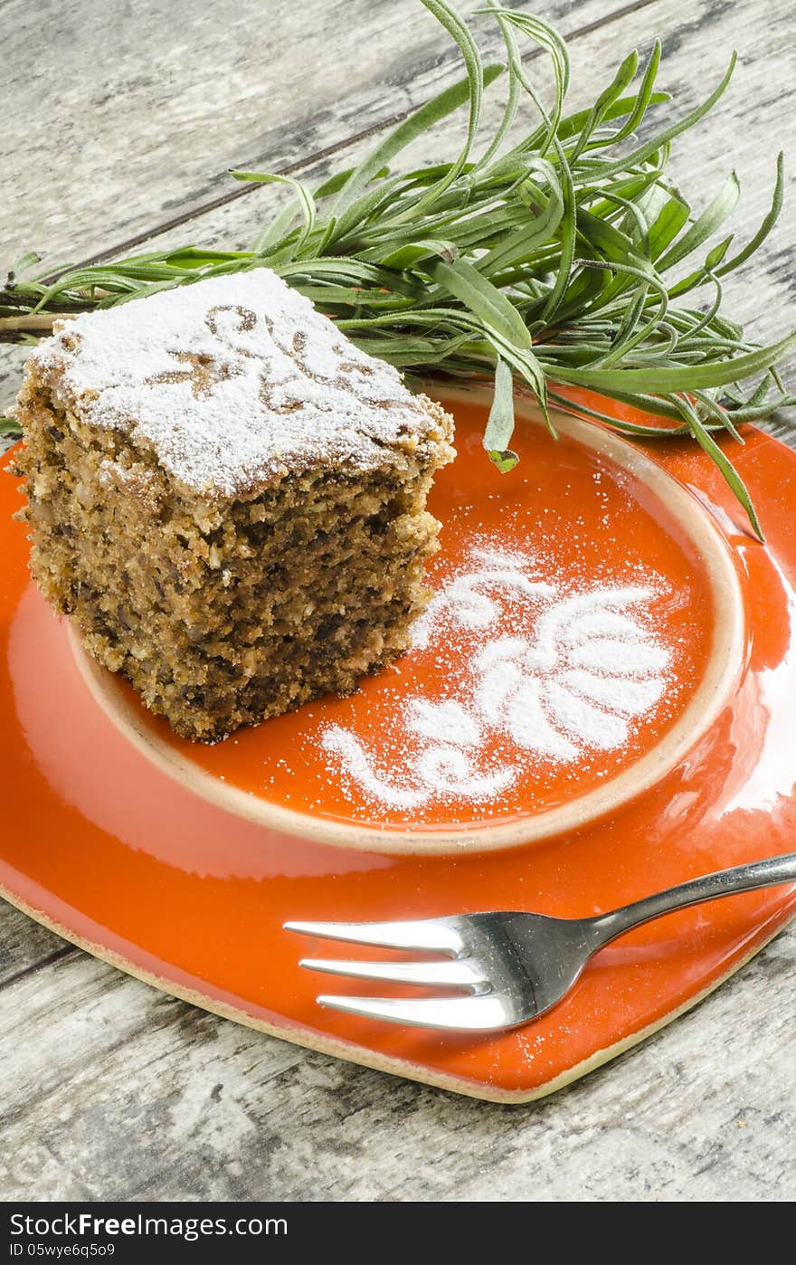 Pumpkin cake on orange plate with lavender lives