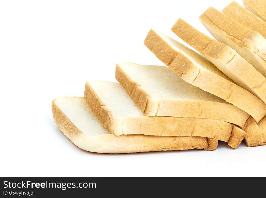 Sliced white bread on white background .