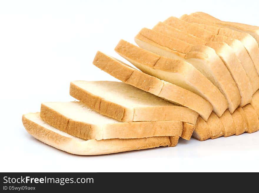 Sliced white bread on white background .