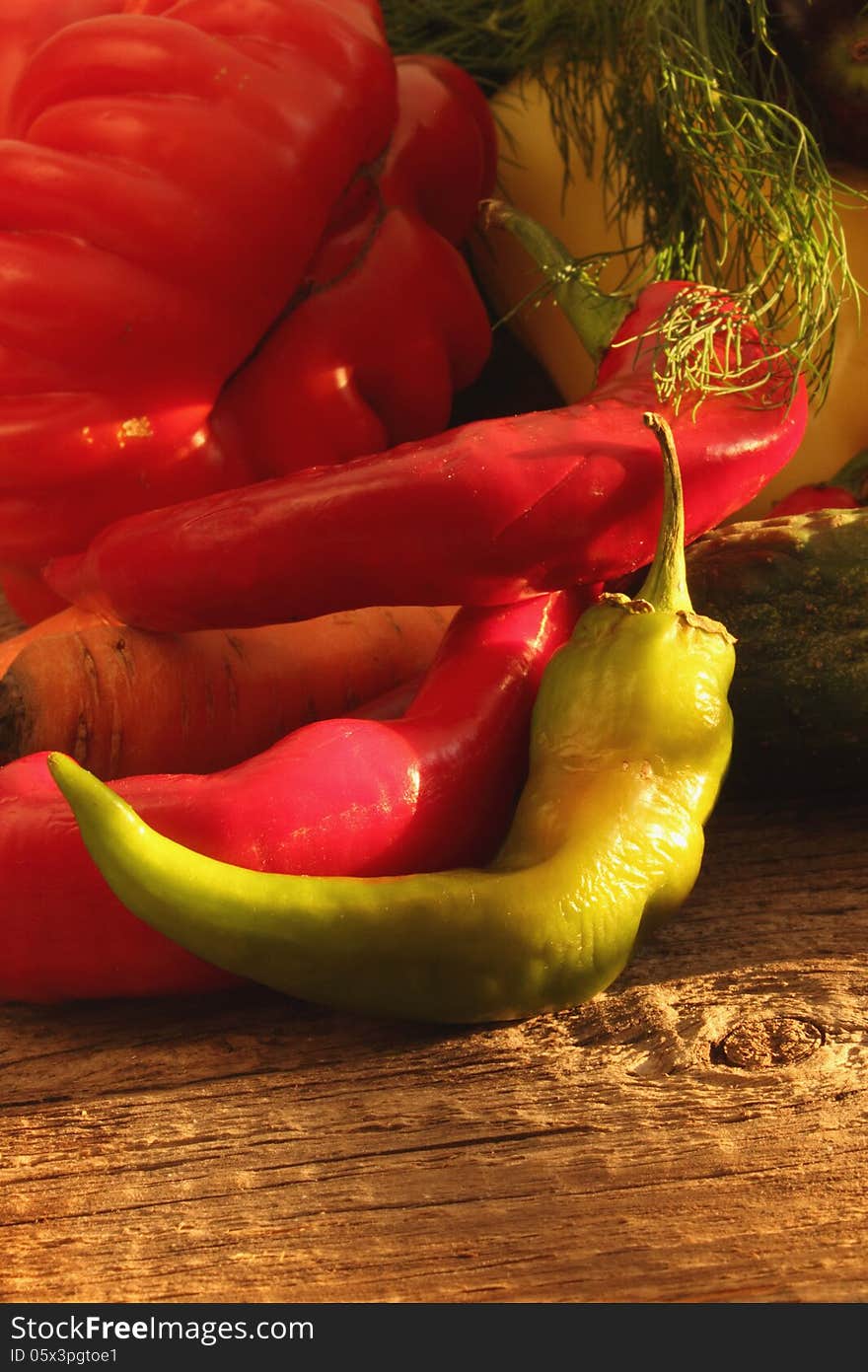 Vegetables on the brown wooden background