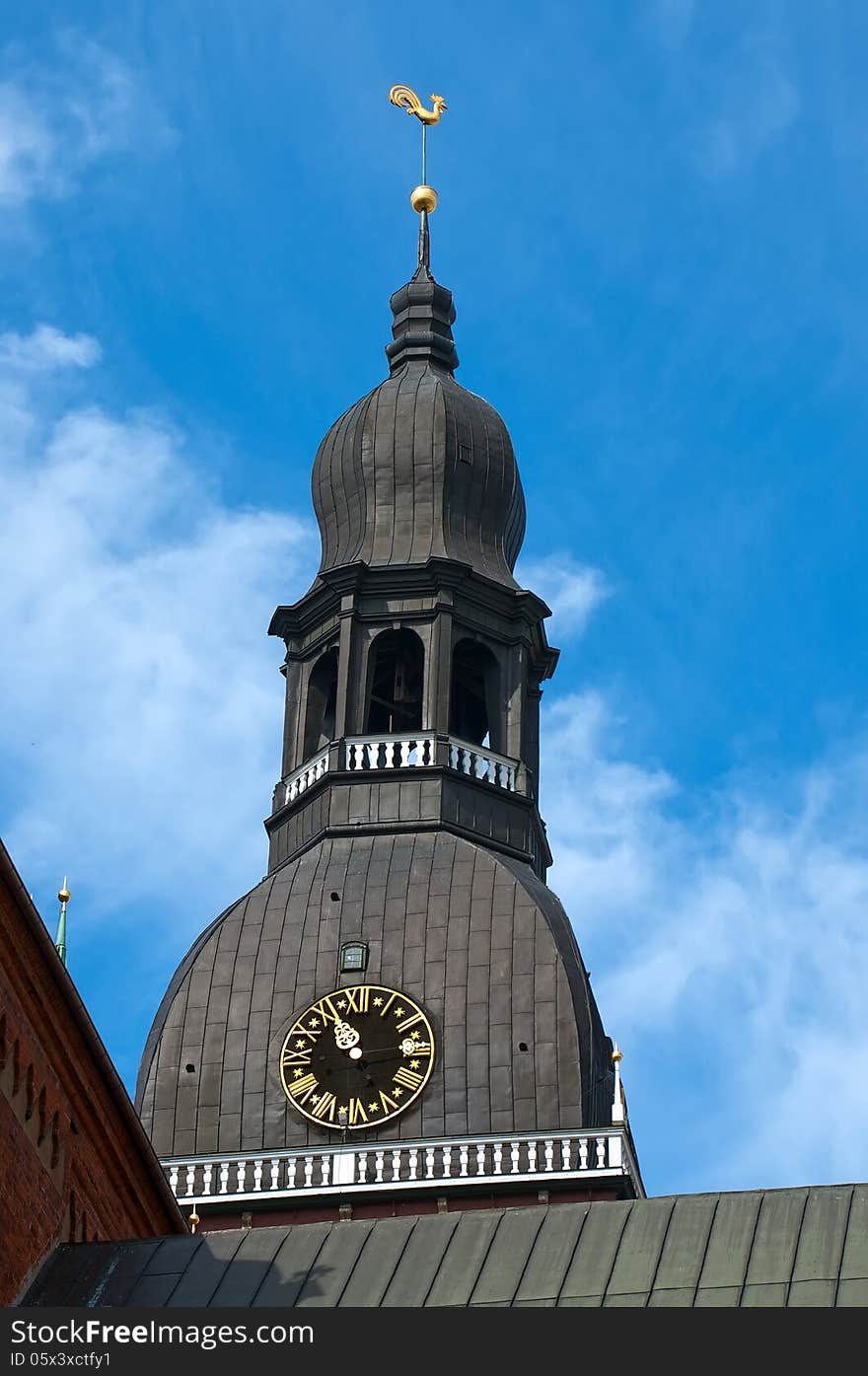 Cathedral tower with a weather vane in the form of a cockerel