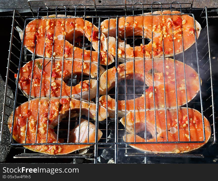 The fish Salman baked on a mangal at the decaying corner. The fish Salman baked on a mangal at the decaying corner