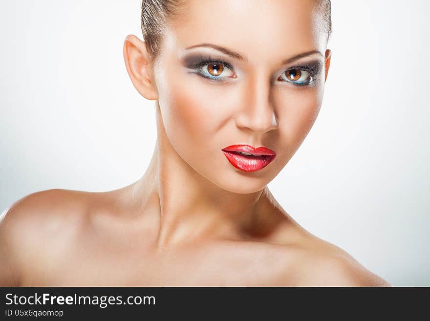 Portrait of beautiful woman with makeup on white background