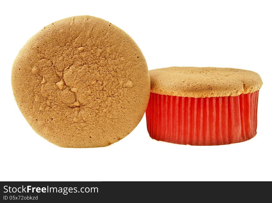 Two delicious sponge cake in red paper cup on white background. Two delicious sponge cake in red paper cup on white background