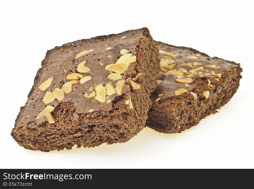 Pile of delicious almonds brownies on white background. Pile of delicious almonds brownies on white background