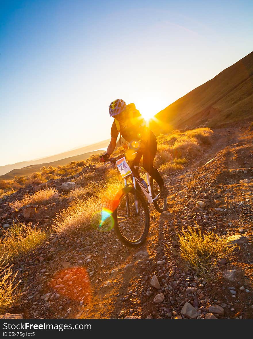 Girl on a bicycle in the mountains