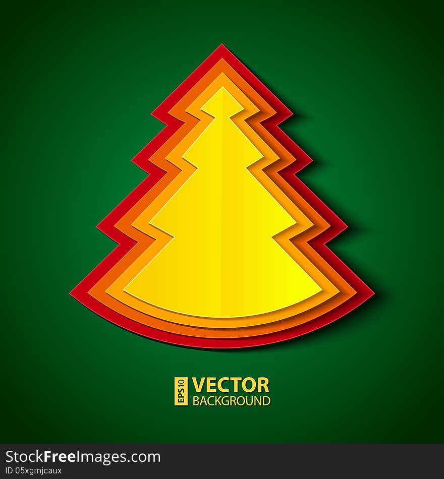 Red, orange and yellow paper folded christmas tree on green background. Red, orange and yellow paper folded christmas tree on green background