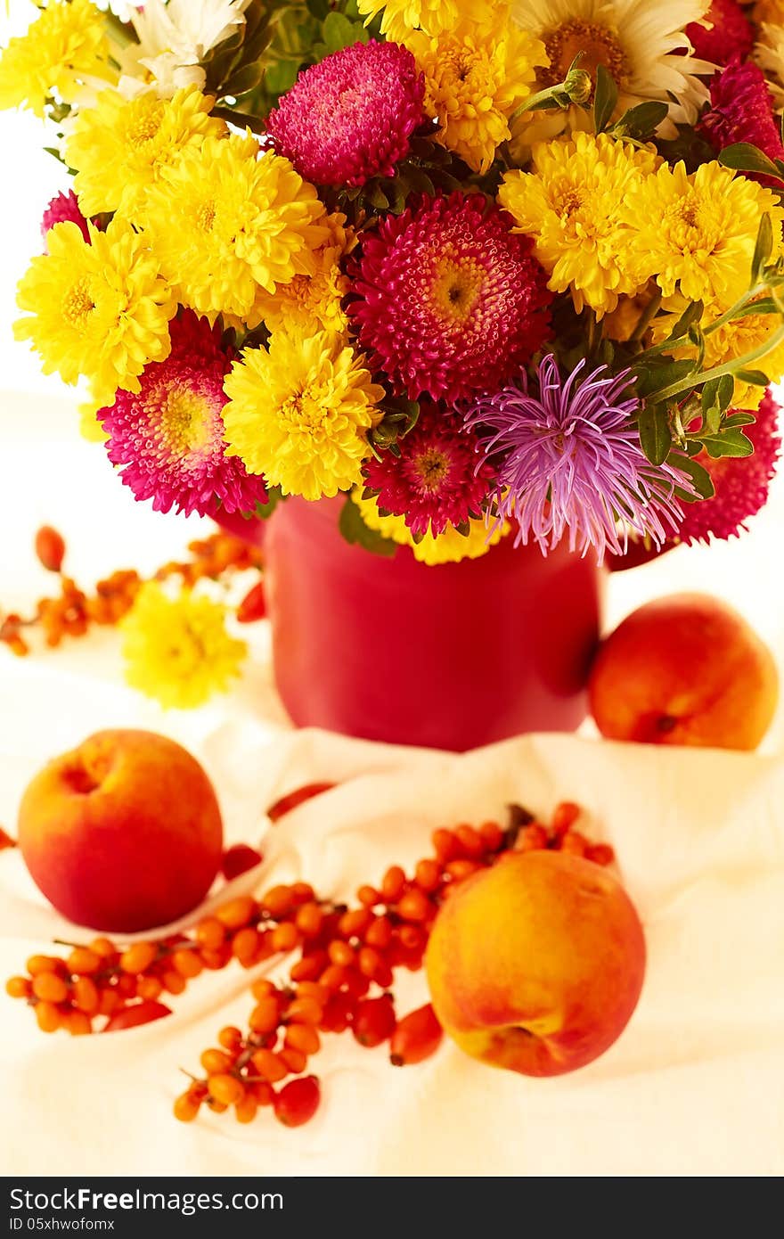 Still life with autumnal flowers and fruits. Still life with autumnal flowers and fruits