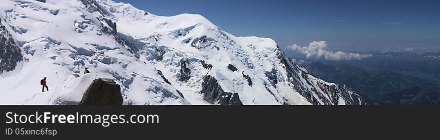 Snow peaks of Mont-Blanc mountain massive, close, panoramic. Chamonix, France. Taken in July 2013. Snow peaks of Mont-Blanc mountain massive, close, panoramic. Chamonix, France. Taken in July 2013.