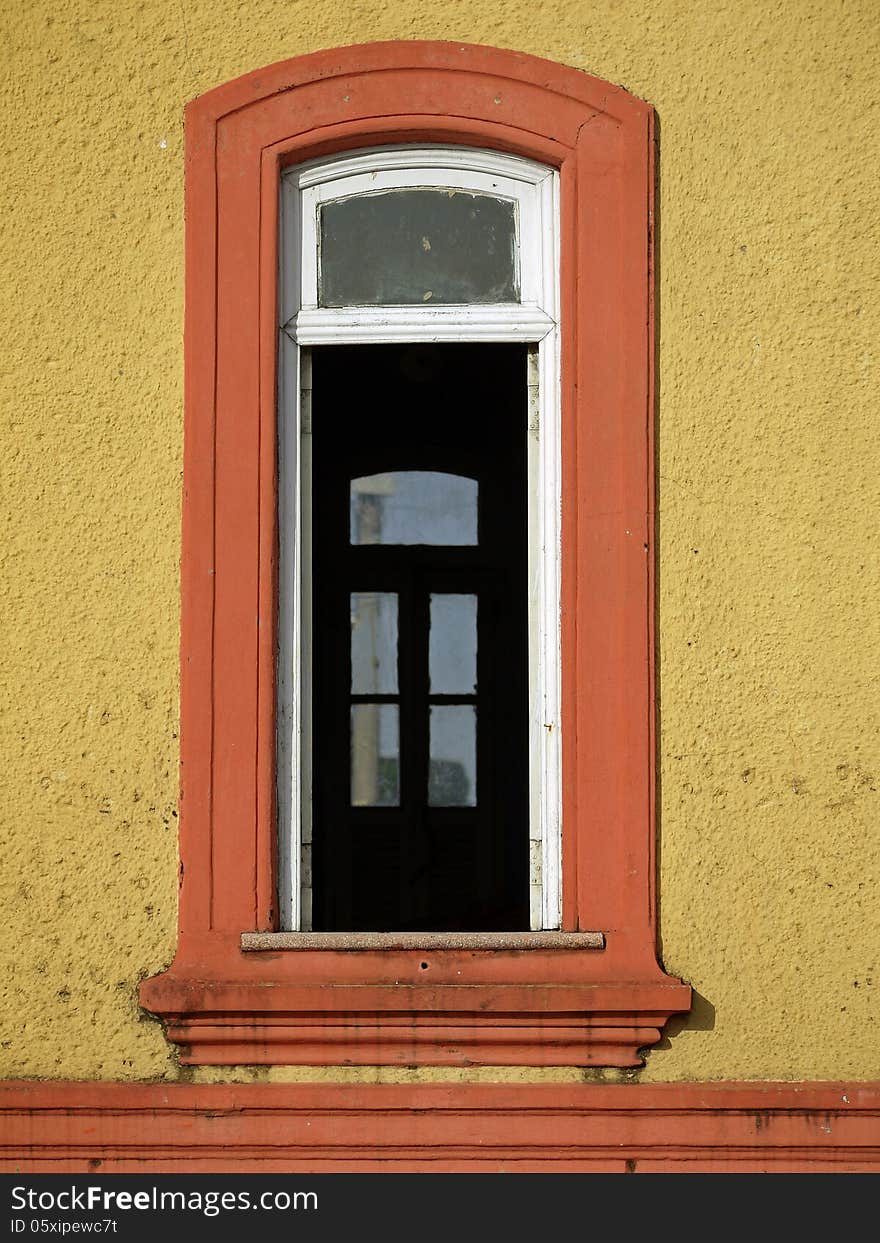 Old window with white shutters and yellow wall - Brazil