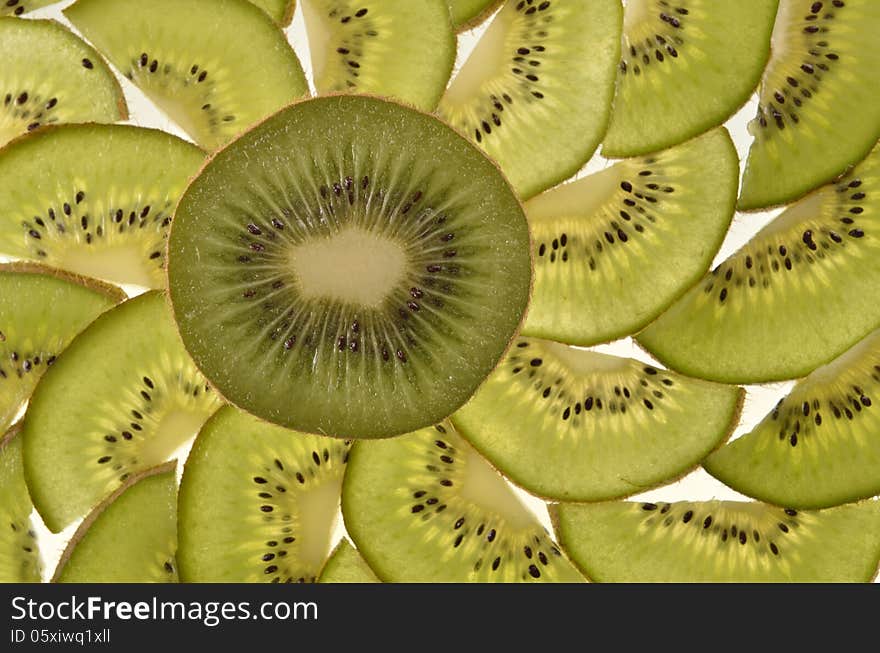 Half kiwi fruit on a background of the pieces