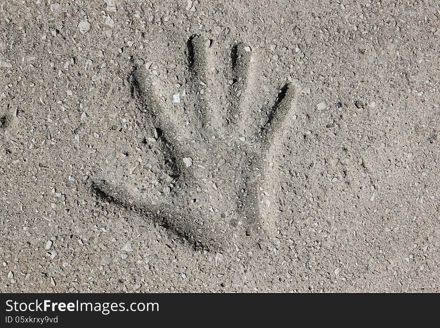 Imprint of a hand in concrete. Imprint of a hand in concrete