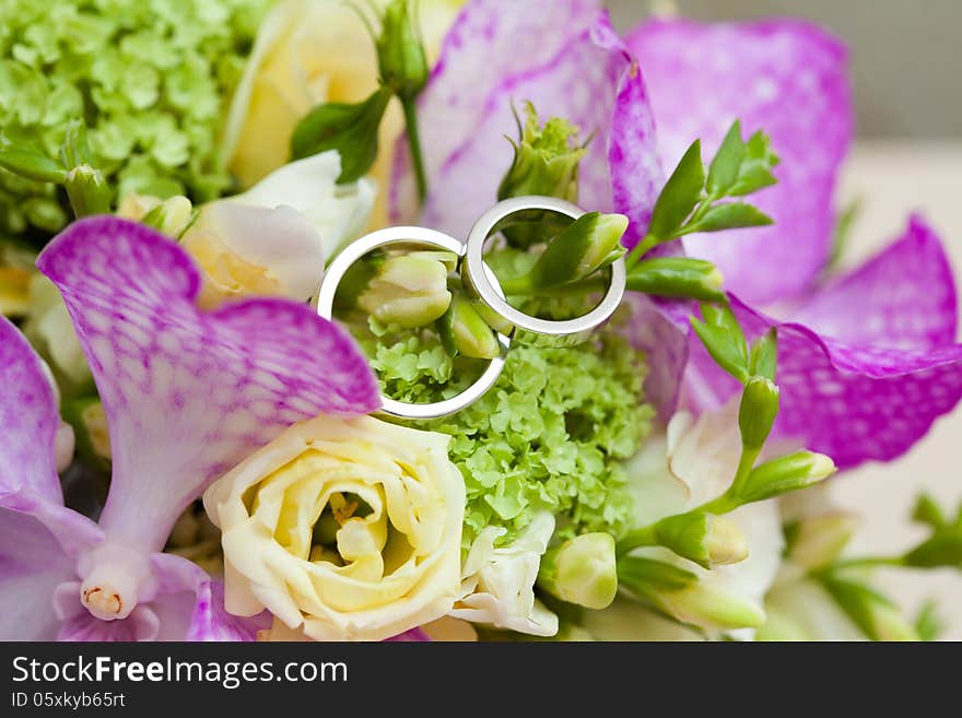 Two wedding rings and wedding background.