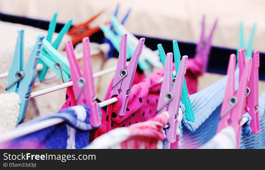 Colored plastic clamps for hanging up the washing