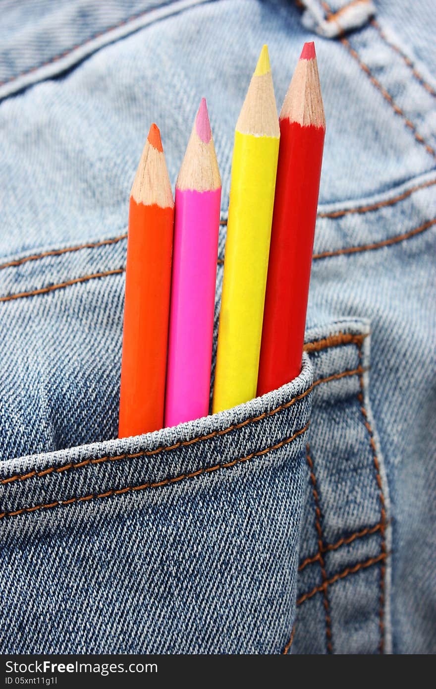 Colour pencils coming out from a pocket. Colour pencils coming out from a pocket