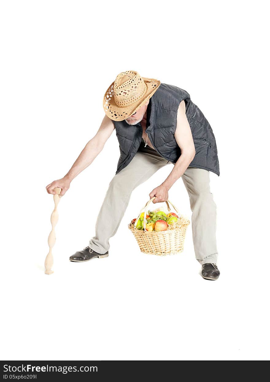 Elderly man with a basket of fruit and cane on white background