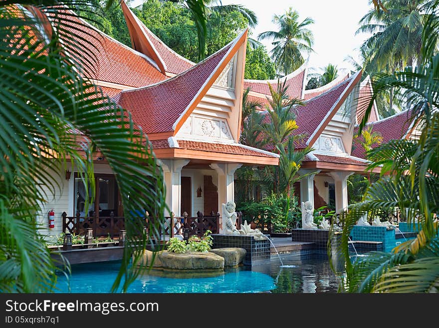 Swimming pool in tropical resort, with backdrop of jungle. Swimming pool in tropical resort, with backdrop of jungle