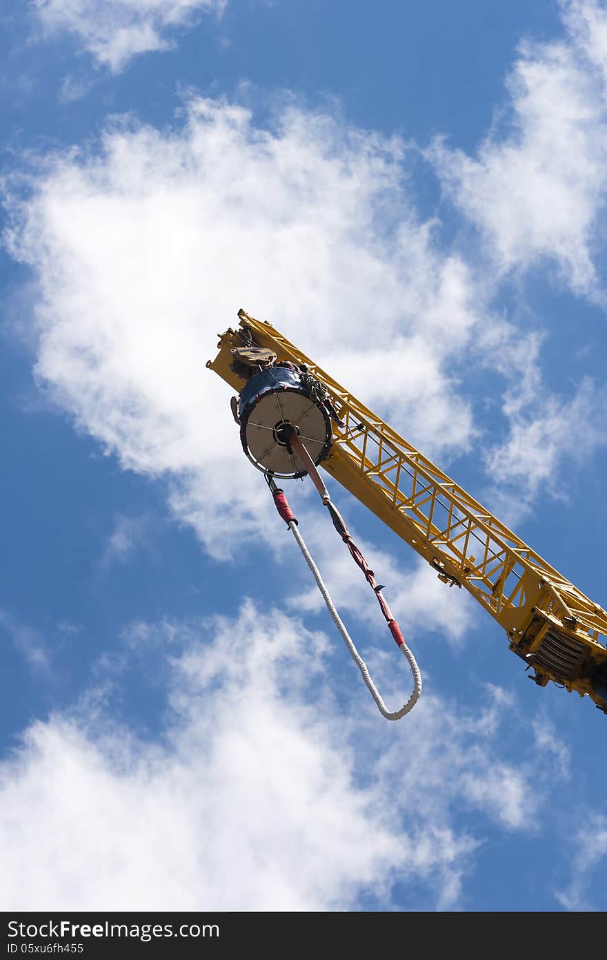 Bungee jumping - extreme sport over blue sky