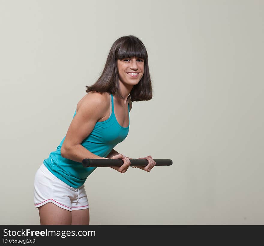 Attractive brunette woman doing fitness exercises for hands