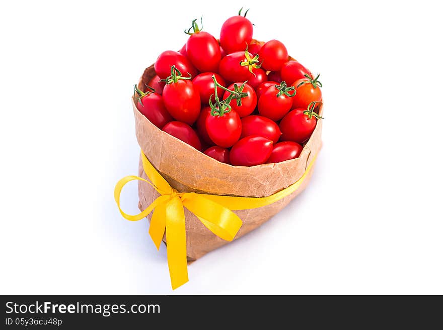 Tomatoes in paper bag isolated on white