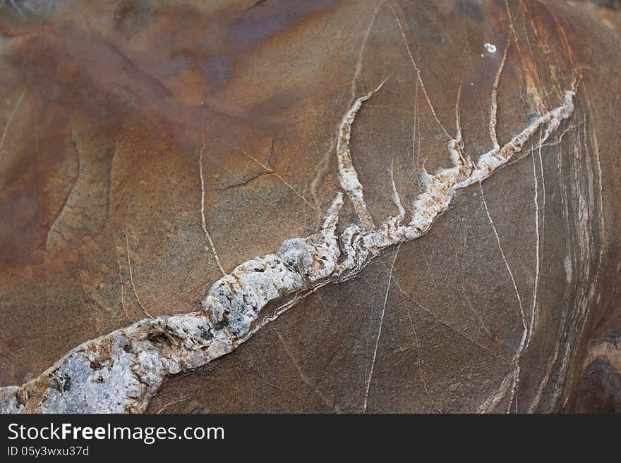 Surface of natural   rust-streaked stone