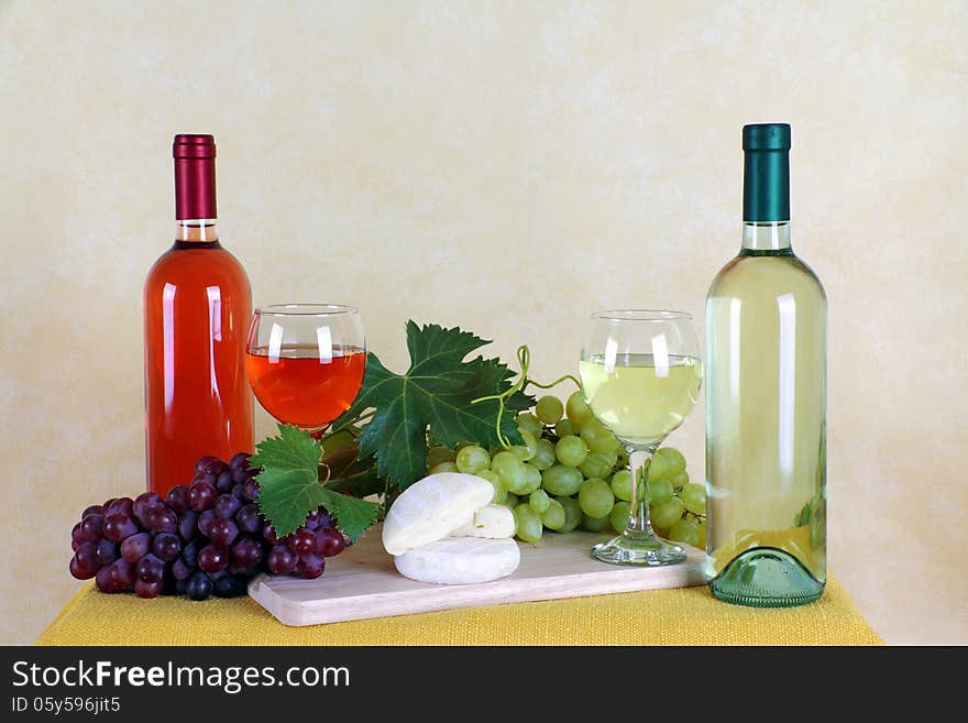 Wine rosé and white wine with grapes and cheese typical. Wine rosé and white wine with grapes and cheese typical