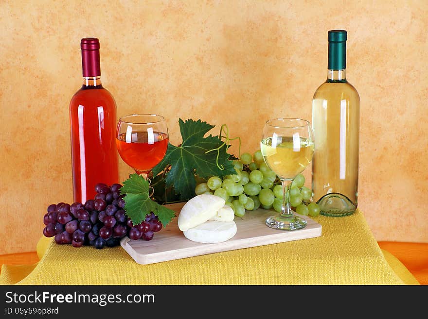 Wine rosé and white wine with grapes and cheese typical. Wine rosé and white wine with grapes and cheese typical