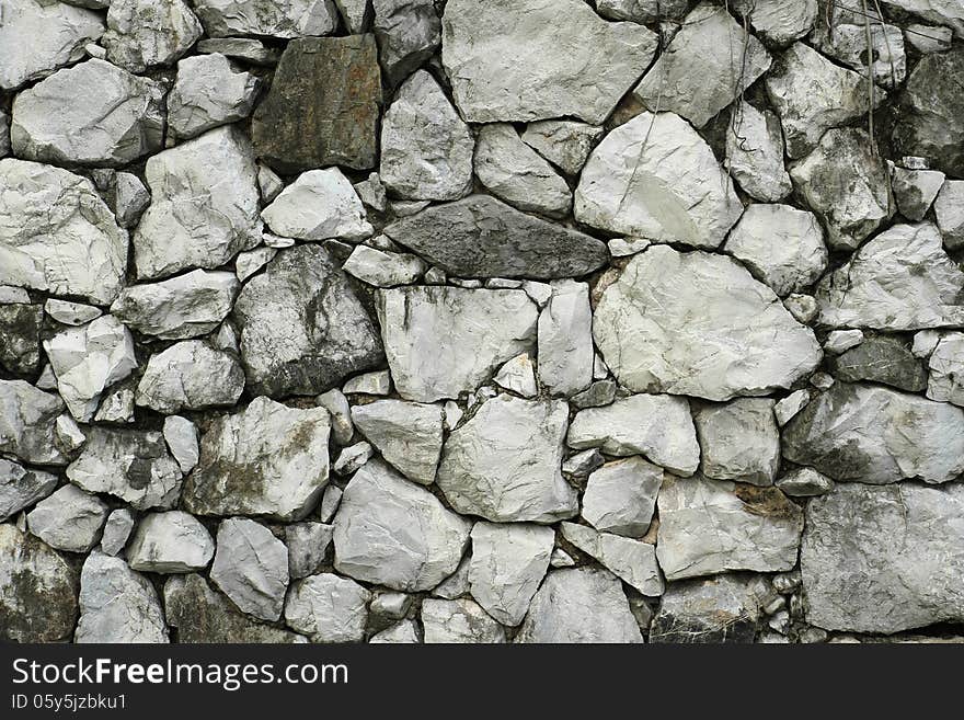 Pattern of old stone wall texture background