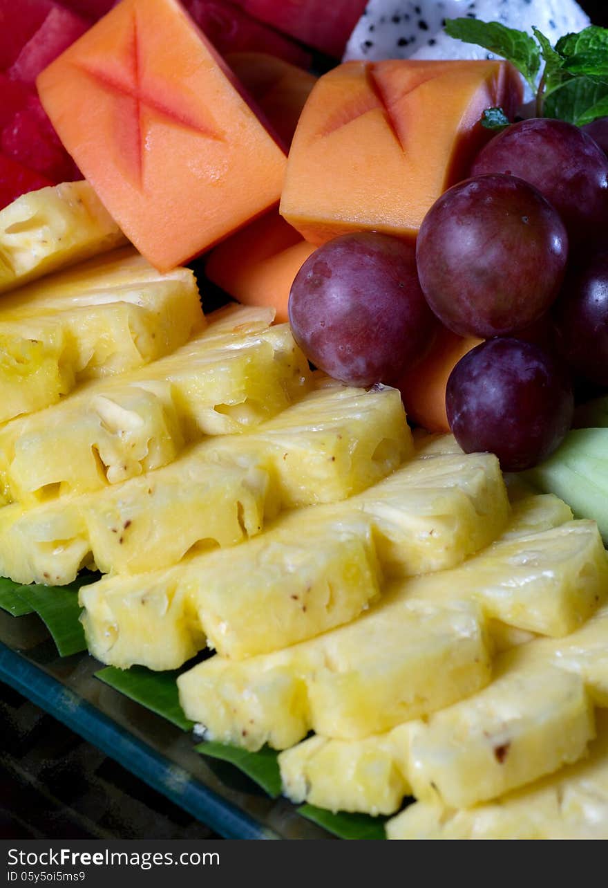 Fresh asian fruit peeled pineapple papaya grape. Fresh asian fruit peeled pineapple papaya grape