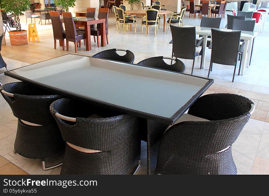 Empty restaurant with set tables and modern chairs.Elegant furniture for resort. Empty restaurant with set tables and modern chairs.Elegant furniture for resort.