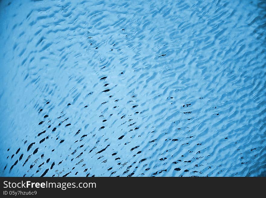 Blue water waves in swimming pool