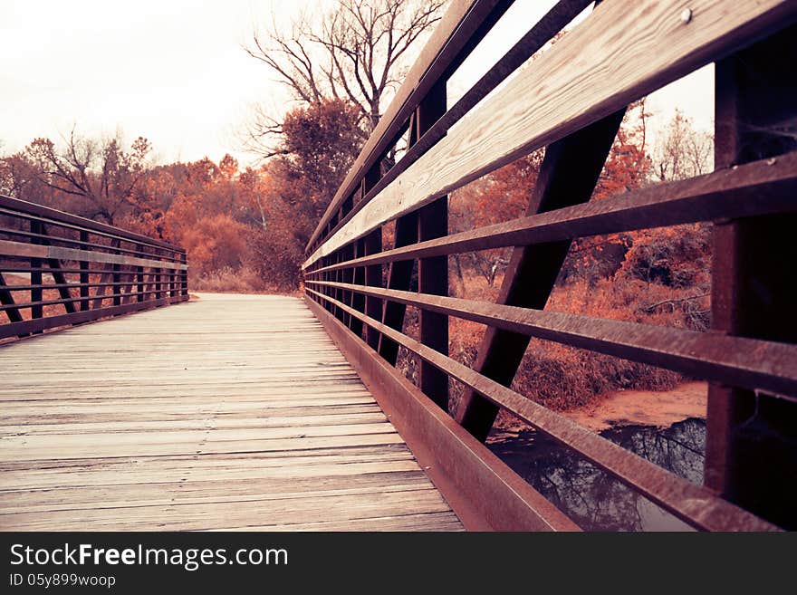 Bridge over the river at autumn day