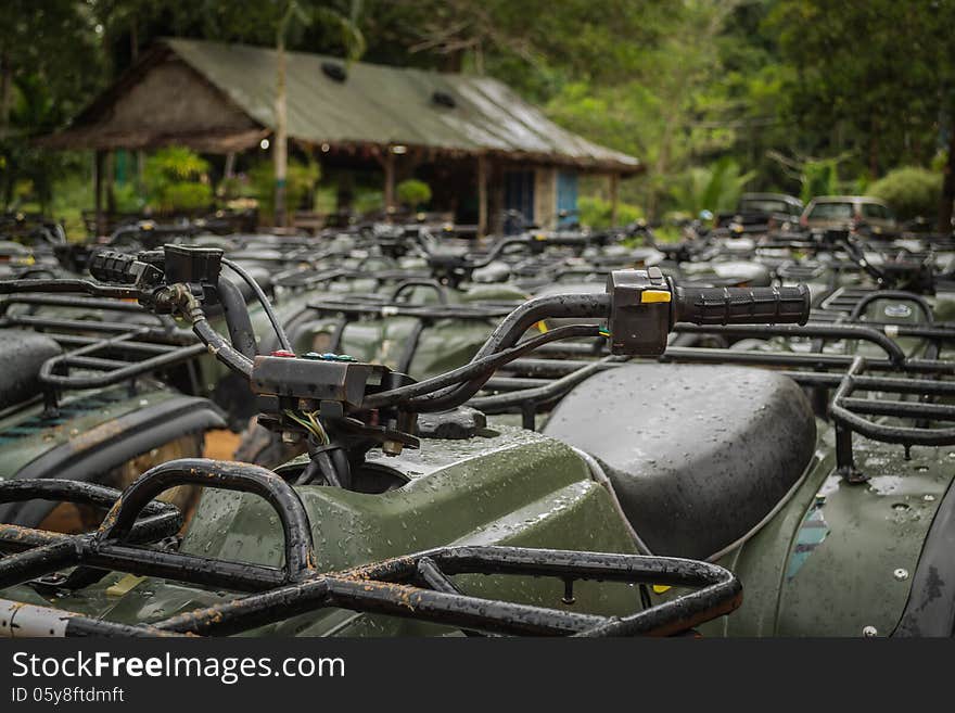 Sports quad bike or atv arranged in row